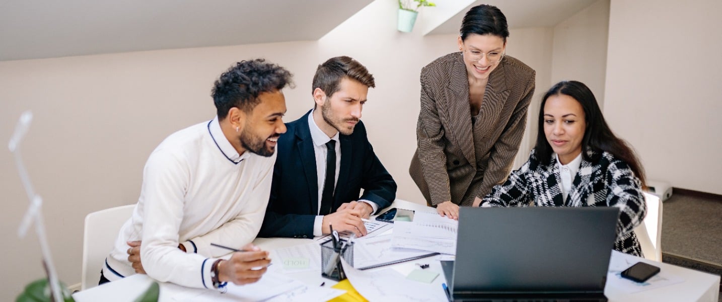 A group of accountants discussing the benefits of digital accounting.