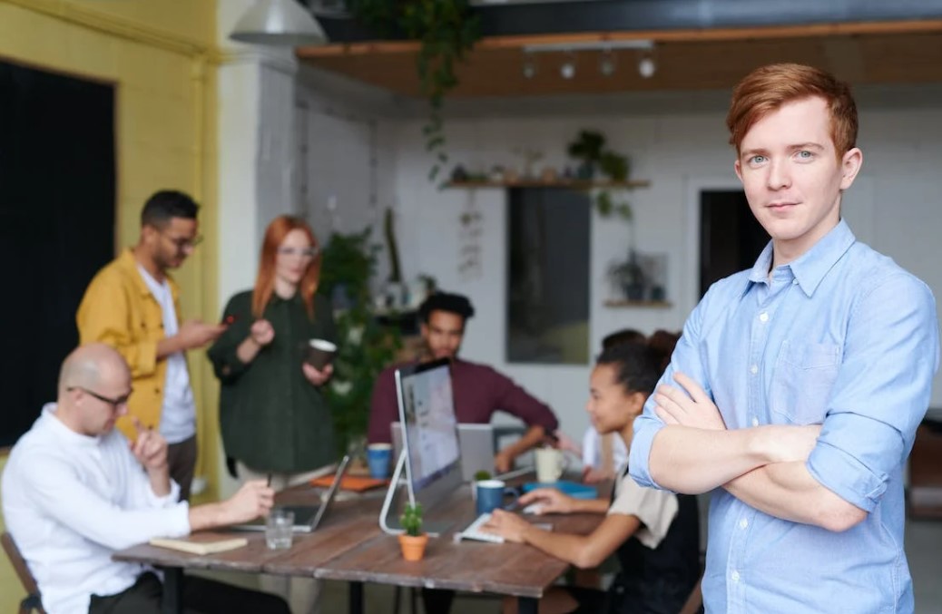 Man standing behind a team