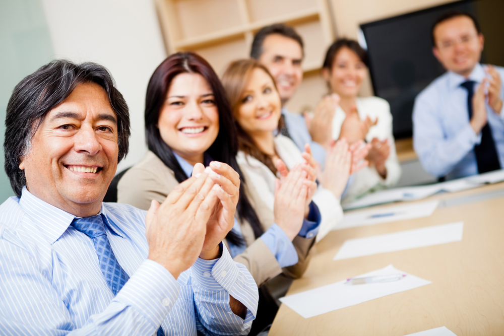 Successful business team in a meeting applauding