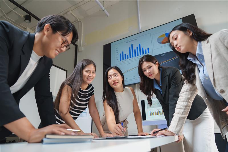 business-team-analyzing-charts-on-a-large-screen-i-2025-09-14-06-35-12-utc