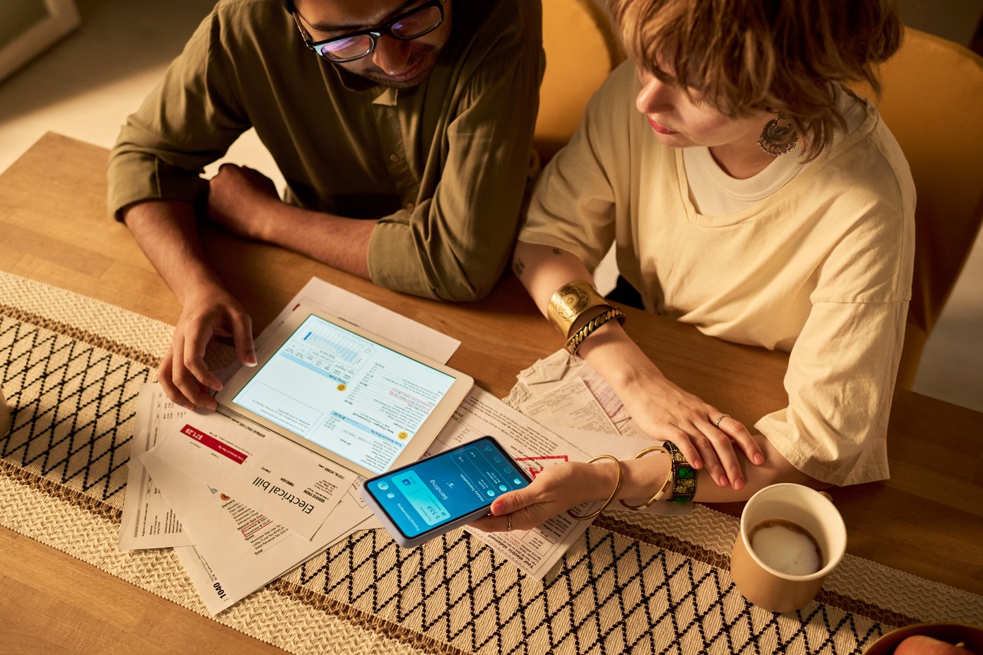couple-reviewing-finances-on-devices-at-table-2026-01-09-06-53-37-utc