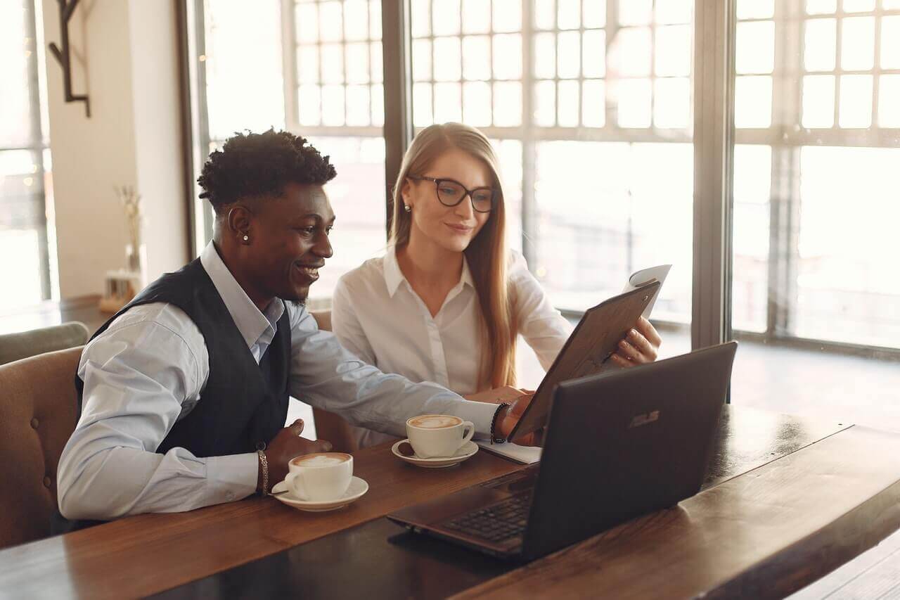 smiling-multiracial-coworkers-working-together-in-modern-3873864-cmprsd