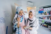 Women discussing fraud management (Source: Pexels @mentatdgt)