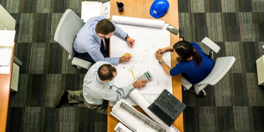 Three-people-discussing-about-how-automation-can-help-your-business