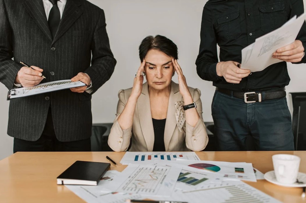 A business owner stressed about what to do regarding overwhelming financial matters.