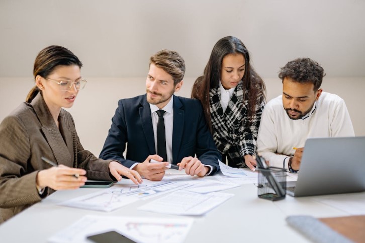 A group discussing mergers and acquisitons
