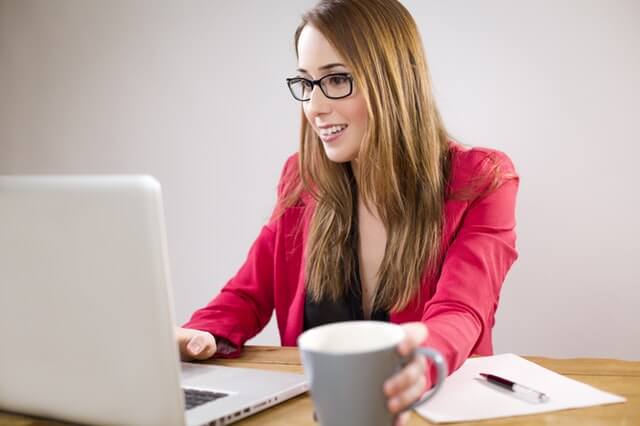 Business woman enjoying an integrated business system for e-commerce