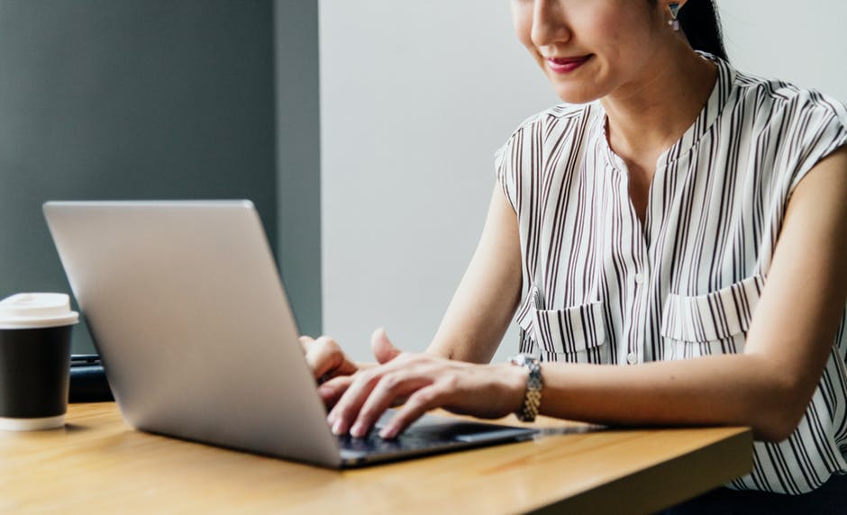 Woman using a laptop to work