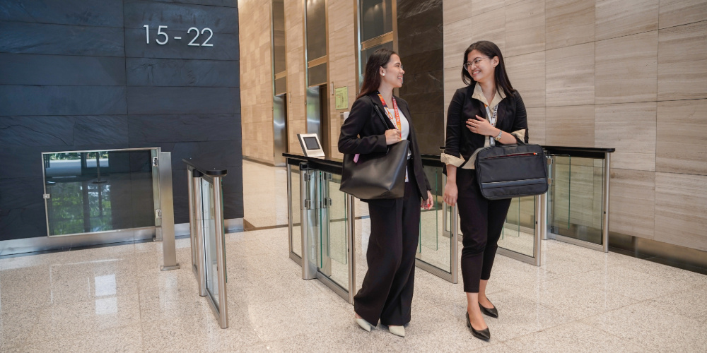 two employees discussing what family office outsourcing is