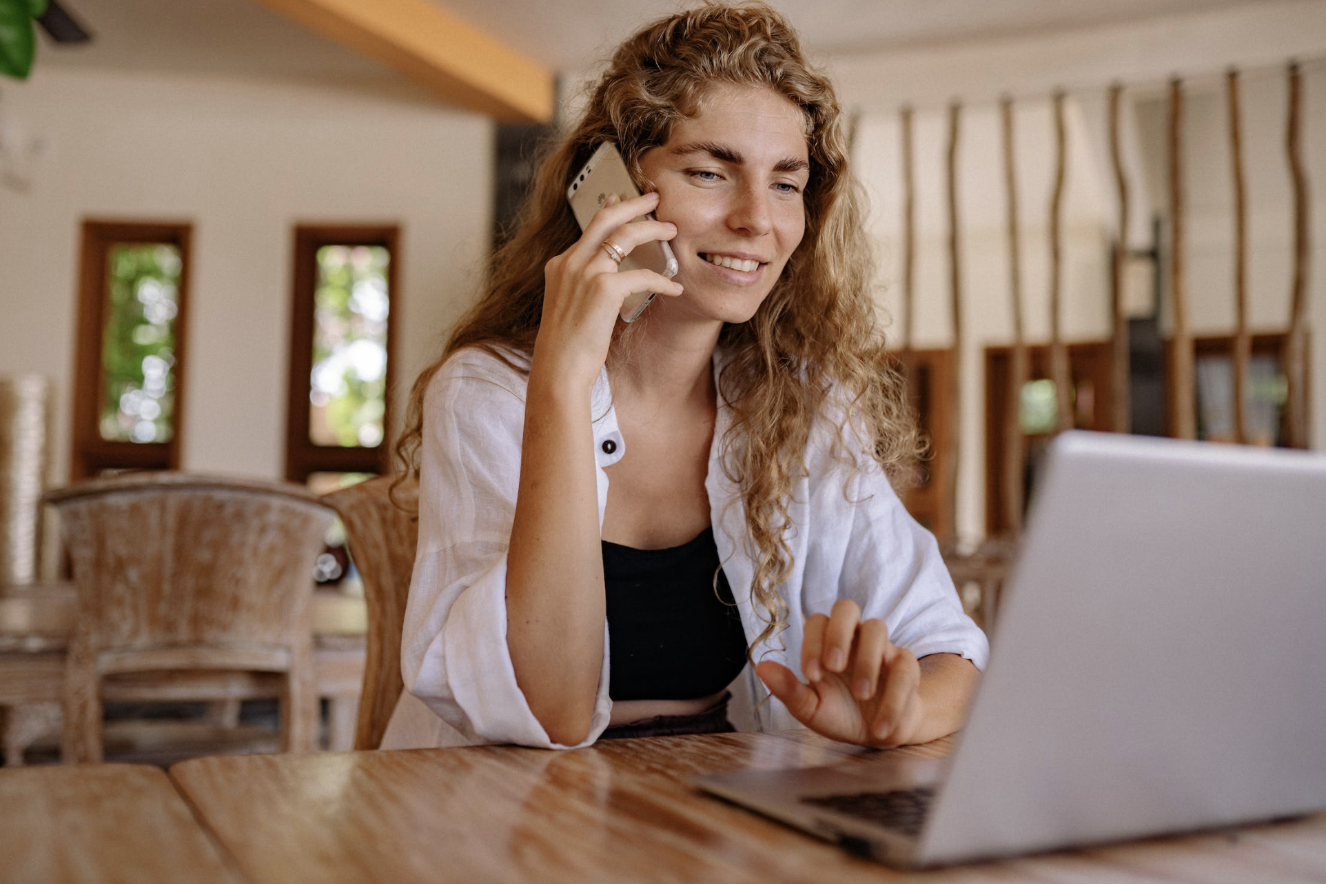 A woman talking to her offshore accounting services provider