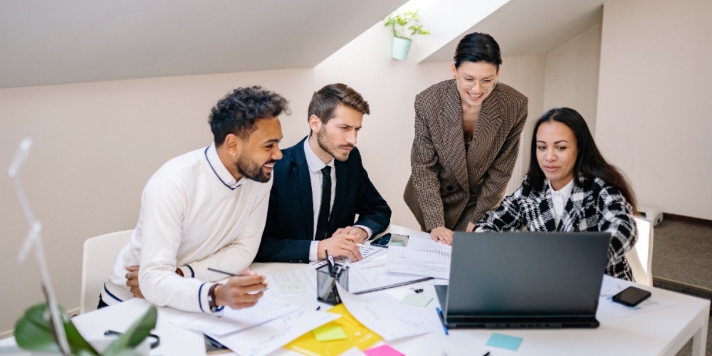 A group of accountants discussing the benefits of digital accounting.